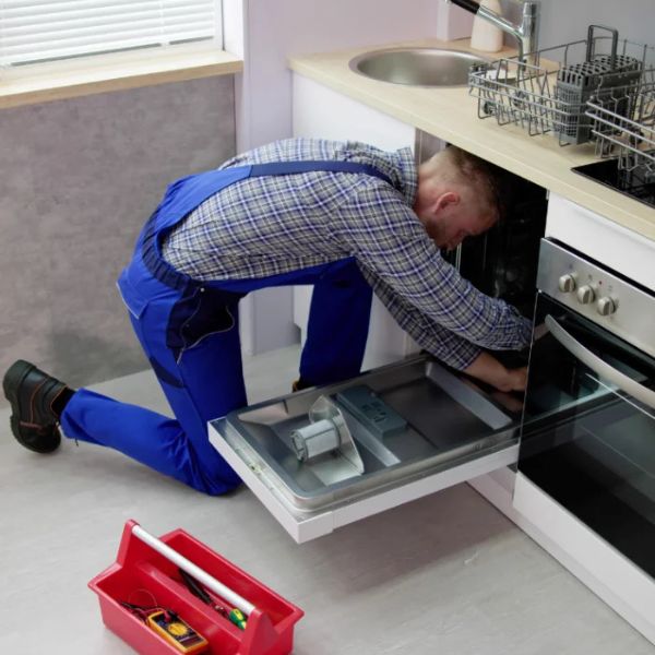 Plumber working on pipes